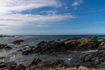 View of the rocky seaside with surf