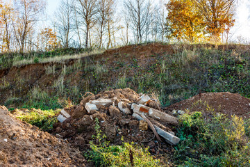 Heaps of soil together with concrete from a construction site