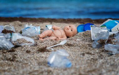 The concept of pollution of nature and the oceans, plastic trash on the beach