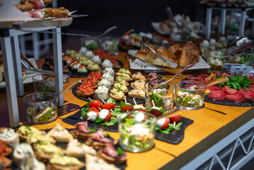 Exquisite buffet display featuring a vibrant assortment of canapes for a sophisticated gathering