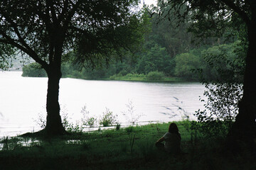 Analog Photo of Person Looking Thoughtfully at a Lake