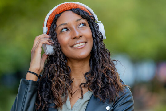 portrait of beautiful young latina woman with headphones