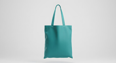 Teal totebag hanging white backdrop bright studio lighting mockup clean sharp canvas totebag