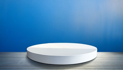 white circular display platform against a soft blue wall