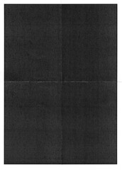 folded magazine page, dark paper print overlay.