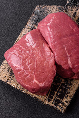 Raw beef tenderloin ribeye steak with salt and spices