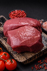 Raw beef tenderloin ribeye steak with salt and spices