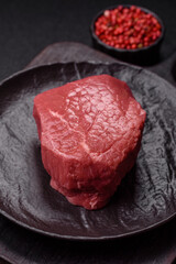 Raw beef tenderloin ribeye steak with salt and spices