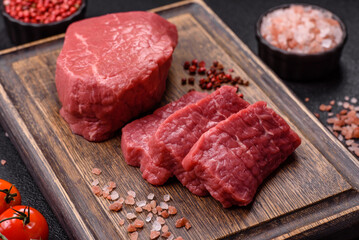 Raw beef tenderloin ribeye steak with salt and spices
