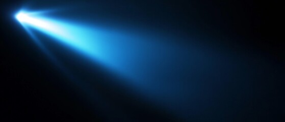 A black background with a beam of bright blue light. Bright blue beam of light cutting through the darkness creating a visual energy effect.