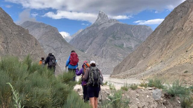 Hikers enjoying a challenging trek in the scenic baltoro glacier region of pakistan