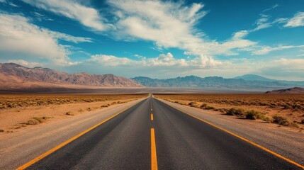 Explore the endless desert road under a dramatic sky and mountains, inviting you on an adventurous journey. Perfect as a backdrop for your designs.
