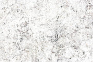 Rough stone wall texture with gray and grunge patterns. Natural rock surface with concrete and marble details. Abstract background with weathered cement and granite structure.