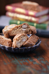 Cantuccini (Italian cookies) on dark wooden background. Close up