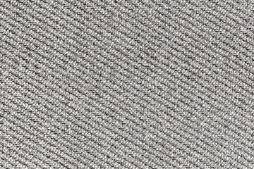 Abstract closeup of textured gray fabric with detailed fibers. Monochrome textile pattern of cotton or jute material. Grunge style background for design and decoration.