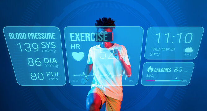 African man jogging or using augmented reality goggle and artificial intelligence practicing and training. Male model with shirt doing running posture and looking at hologram. Technology. Ingenuity.