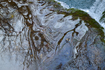 Obraz premium Close up river water reflection near waterfall. Slapnica river, Žumberak, Croatia