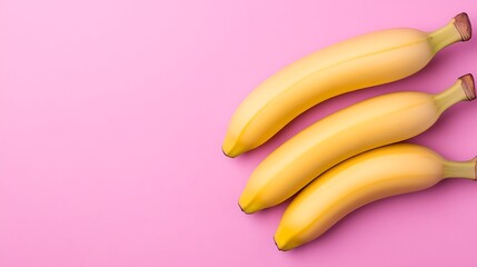 Three bananas on a pink background (1)