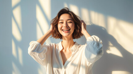 Smiling young woman dressed in white