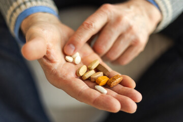 Hands with pills. Senior man hands holding medical pill. Mature old senior grandfather taking medication cure pills vitamin. Age prescription medicine healthcare therapy concept