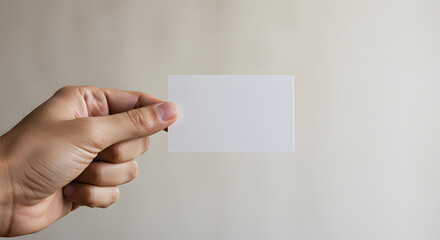 Obraz premium Square blank business card hand holding background close up shot personal intimate view