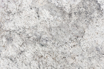 Rough stone and concrete wall texture with grunge patterns. Aged and weathered surface with detailed gray and granite structure. Closeup of natural rock material for abstract background design.