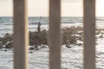 A statue of Neptune in the sea.  © Tibi.lost.in.nature