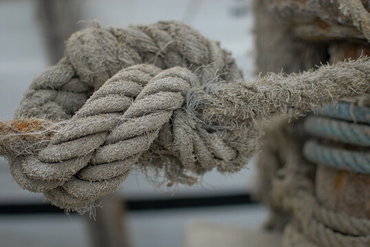 Depth of field 'Tambang Kapal', a big rope or cable, towing line or hawser used to pull or tow a vessel or mooring ship, attached to a tugboat or a mooring point on the port or harbor dock. 