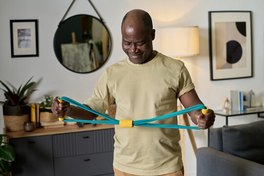Exercising with Resistance Band in Modern Living Room