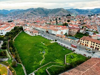 Aerial view of Cusco cityscape and park.