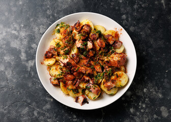 Octopus tentacles and new potatoes warm salad with smoked paprika dressing