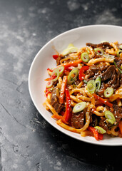 Stir fry udon noodles with beef and vegetable. asian style food
