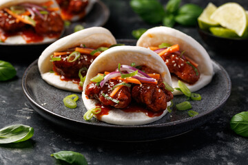 Korean Fried Chicken Bao Buns with vegetables. Asian fast food