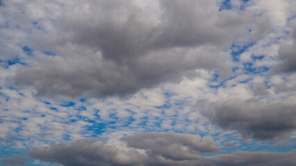 Colorful dramatic sky with autumn puffy clouds background