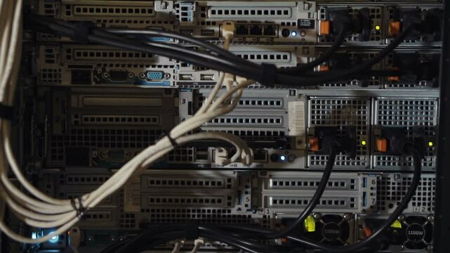 Techical engineer concept: moving from down to up shot of server equipment of personal localhost mining farm bitcoin data center cloud ftp cables switches lights provider ports electronic elements