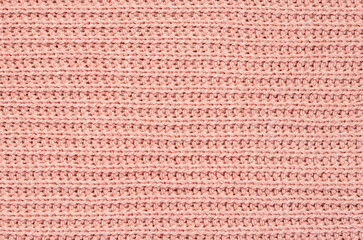 Macro blank photography of pink knitted cloth, fabric textured pattern, sweater, jumper, clothing