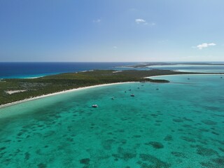Obraz premium Aerial Shot of Remote Bahamas Island From Sky With Tranquil Blue Water Pretty Beach and Turquoise Water