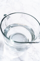 Measuring Glass Cups Filled with Water for Preparation