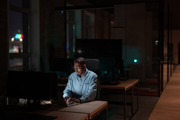 Female businesswoman employee working late in the office, using a laptop while feeling tired and burnt out. Reading, copywriting, editing, and struggling with fatigue and brain fog on a tight deadline