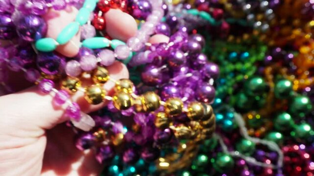 Grabbing a Handful of Beautiful Mardi Gras Beads, first person POV