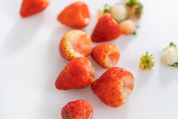 Fresh Strawberries Displayed on a White Cutting Board