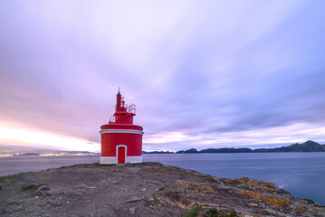Punta Robaleira Lighthouse, located between Cape Home and Punta Subrido, is a flattened cylindrical stone tower and its red color makes it easily recognizable.