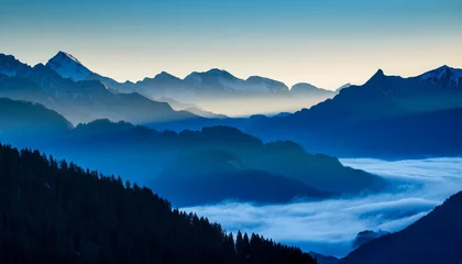 blue moutains silhouette with fog in the valley beautiful fresh and bright morning in the alps © Timothy
