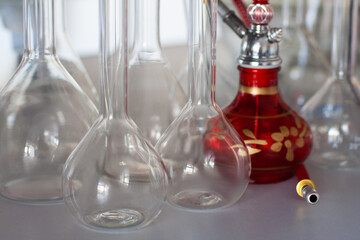 composition of red hookah and chemical glass flasks