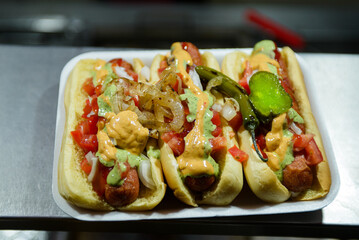 Delicious Street Food Hot Dogs with Toppings on a Tray