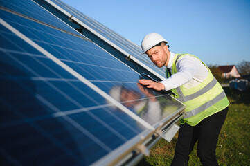 The solar farm, solar panel with engineer check the operation of the system, Alternative energy