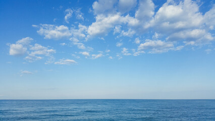 beautiful landscape on the coast of the beach and sea waves against the background of the blue sky