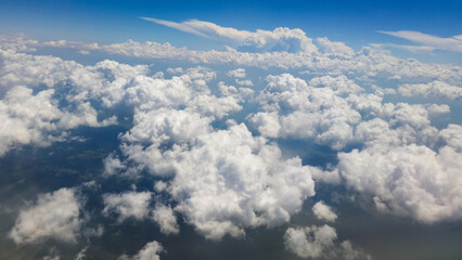 beautiful thick clouds in the sky from the height of the plane