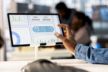African american manager analyzing company data for strategic planning, solving resource allocation and effective business operations. Expert does financial forecasting and data analysis. Close up.