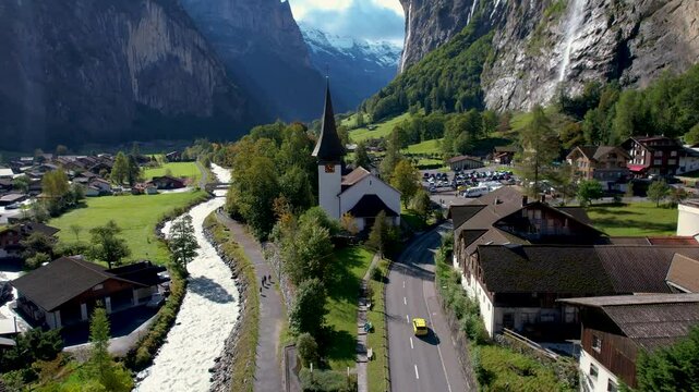 Beautiful aerial footage of Lauterbrunnen, a Swiss Alps valley with stunning cliffs, Staubbach and Tr&uuml;mmelbach Falls. A cable car from Stechelberg leads to Schilthorn, offering breathtaking views.